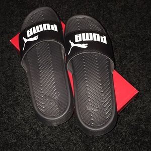 Black and white puma slides